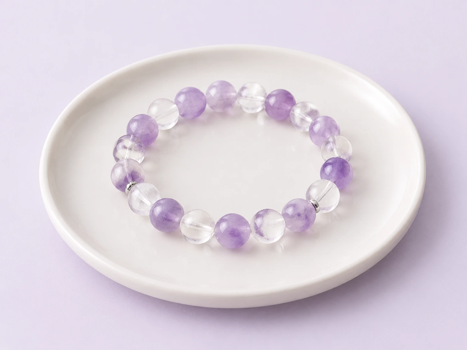 Lavender amethyst and clear quartz bracelet showing natural variations in the stones